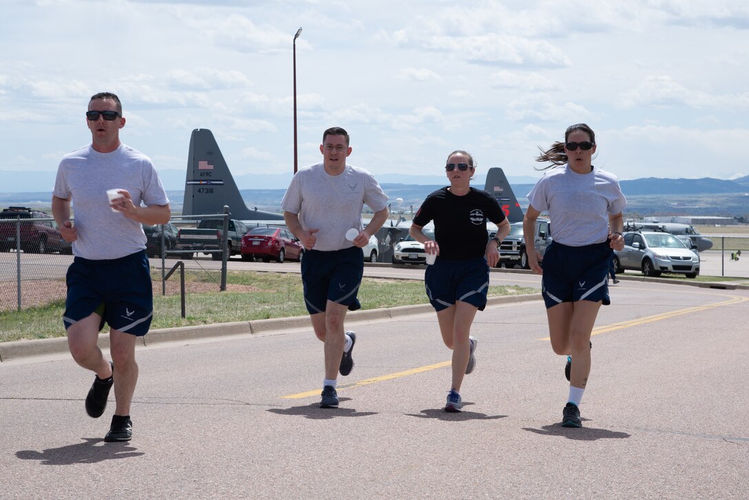 Airmen with the 39th Aerial Port Squadron start the 5th Annual Port Dawg Memorial Run May 4, 2019 at Peterson Air Force Base, Colorado.