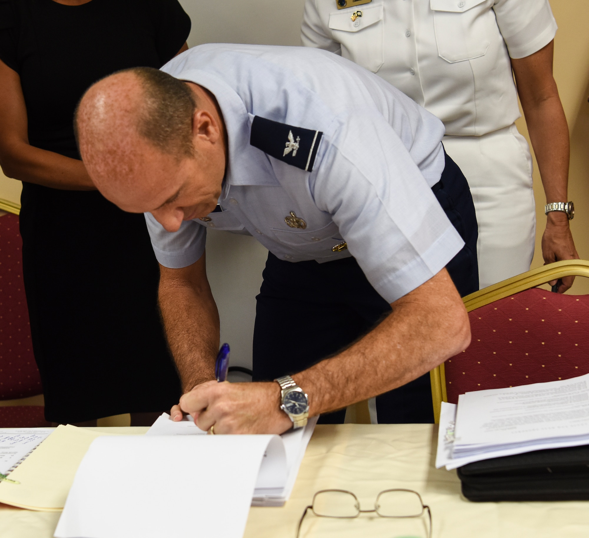 Col. Michael Gimbrone, respresenting U.S. Air Force Pacific Air Forces, signs the Tinian Airfield divert lease May 3, 2019, at Tinian Airport, Commonwealth of the Northern Mariana Islands. The lease is a 40-year agreement intended to benefit both the USAF and Tinian by providing the Air Force a divert runway and stimulating economic growth on Tinian. (U.S. Air Force photo by Tech. Sgt. Jake Barreiro)