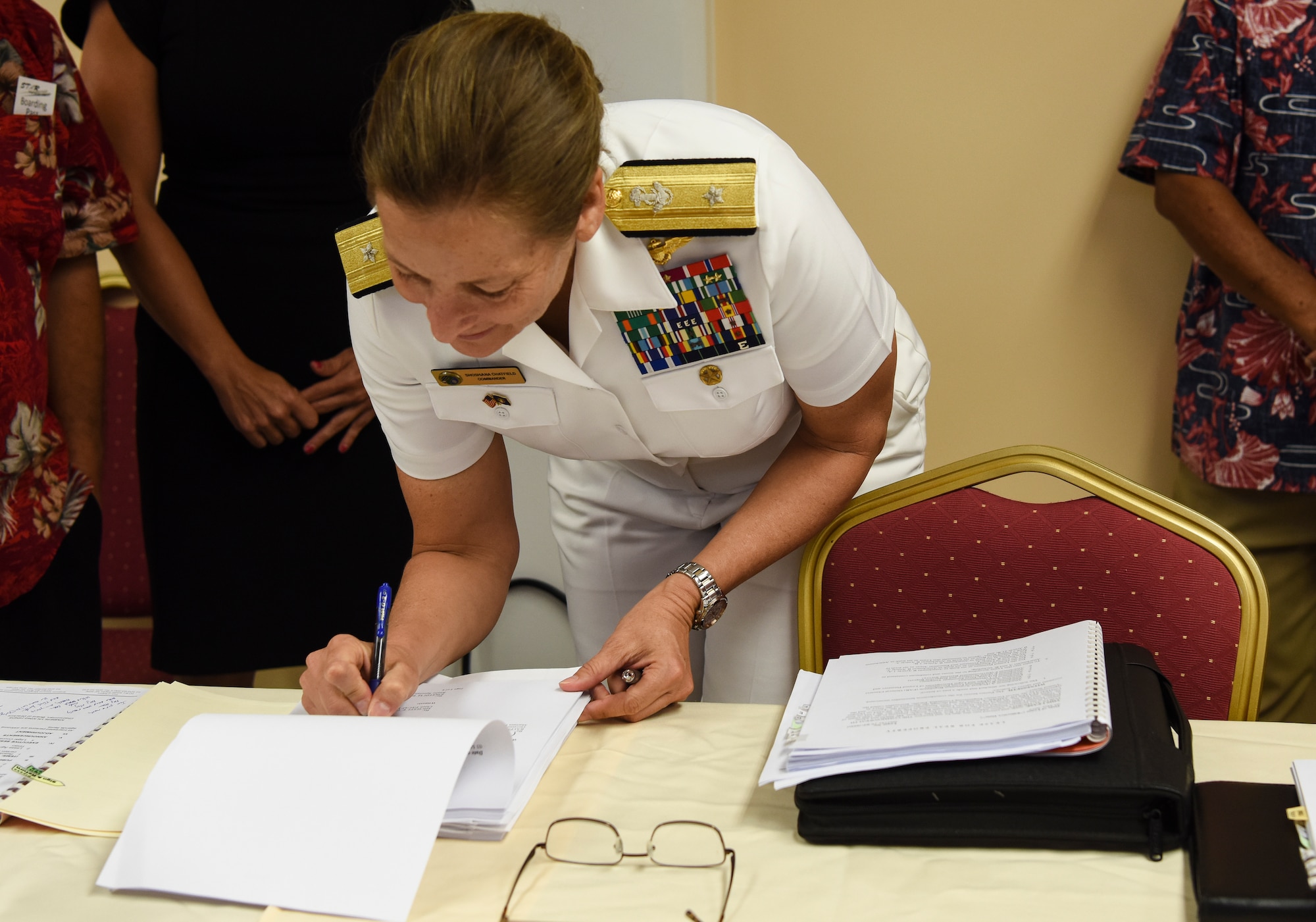 Rear. Adm. Shoshana Chatfield, Joint Region Marianas commander, signs the Tinian Divert airfield lease May 3, 2019, at Tinian Airport, Commonwealth of the Northern Mariana Islands. The $21.9 million lease signing was the culmination of nearly five years of negotiations between the Department of Defense, CNMI government, and Commonwealth Port Authority. (U.S. Air Force photo by Tech. Sgt. Jake Barreiro)