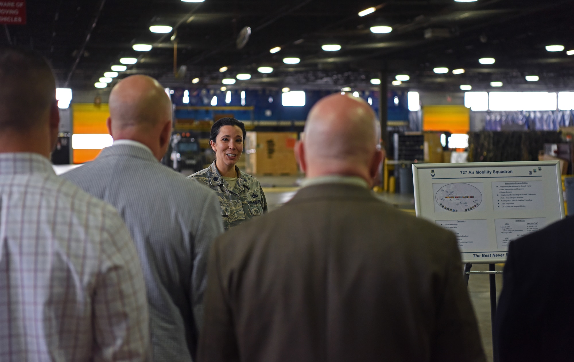 U.S. Air Force Lt. Col. Katrina Smith, 727th Air Mobility Squadron commander, briefs members of the European Command Capstone 19-3 class during a visit to RAF Mildenhall, England, May 6, 2019. EUCOM leaders, consisting of members of all five branches of the U.S. military, discussed infrastructure developments with wing leadership and gained an understanding of the resources needed on base. (U.S. Air Force photo by Airman 1st Class Brandon Esau)