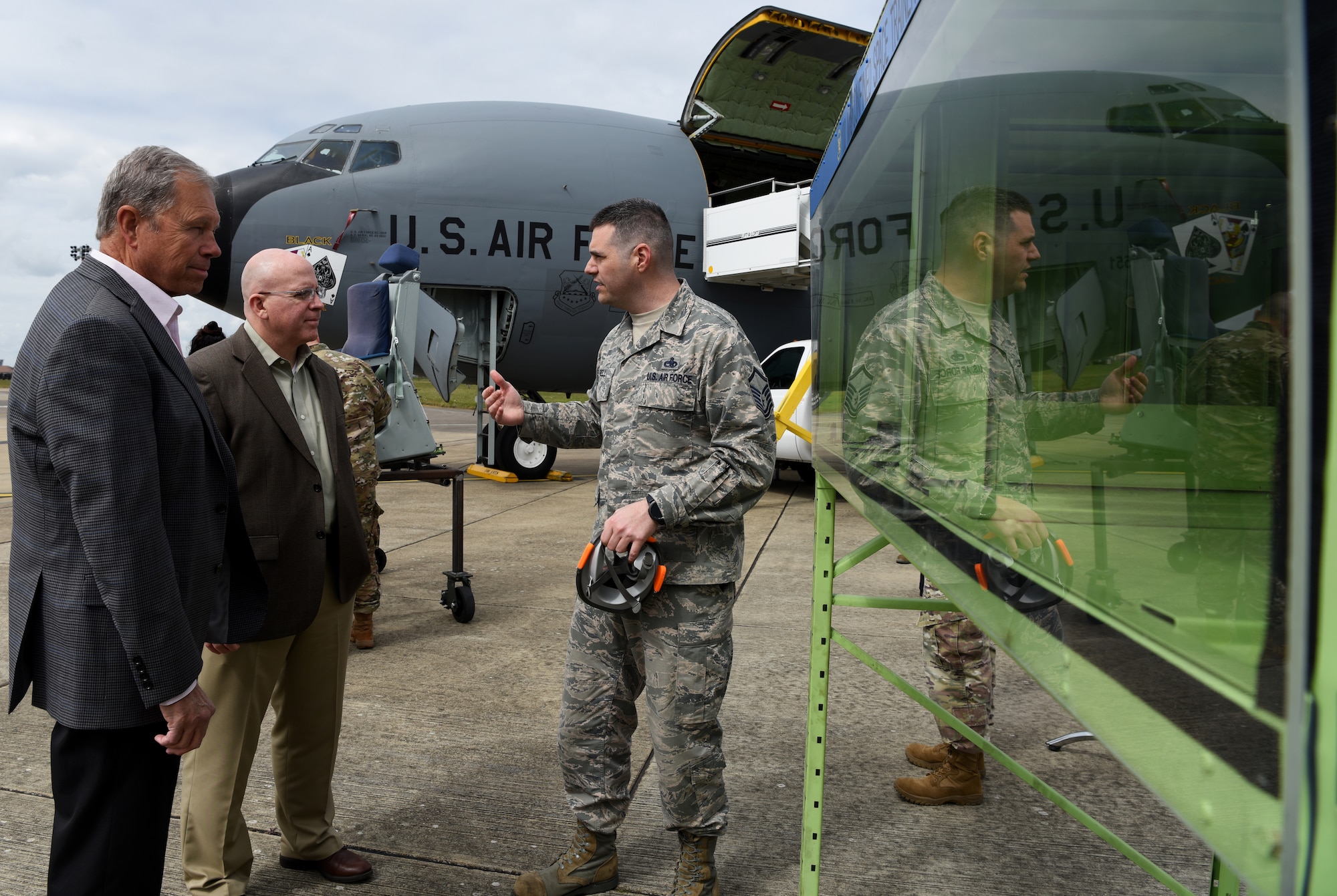 U.S. Air Force Master Sgt. William Bell, 100th Maintenance Squadron accessories flight chief, discusses the integrated communication respirator innovation with Retired U.S. Air Force Gen. William Fraser, former commander of U.S. Transportation Command and senior fellow for the National Defense University, and U.S. Air Force Brig. Gen. Jeffrey King, Director of Logistics, Engineering and Force Protection for Pacific Air Forces Headquarters, Joint Base Pearl-Harbor Hickam, Hawaii, during a visit to RAF Mildenhall, England, May 6, 2019. EUCOM leaders, consisted of members of all five branches of the U.S. military, discussed infrastructure developments with wing leadership and gained an understanding of the resources needed on base. (U.S. Air Force photo by Airman 1st Class Brandon Esau)