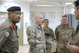 U.S. Army Maj. Peter Fallgren, 452d Combat Support Hospital, speaks to distinguished visitors at Camp Arifjan, Kuwait, May 5, 2019.