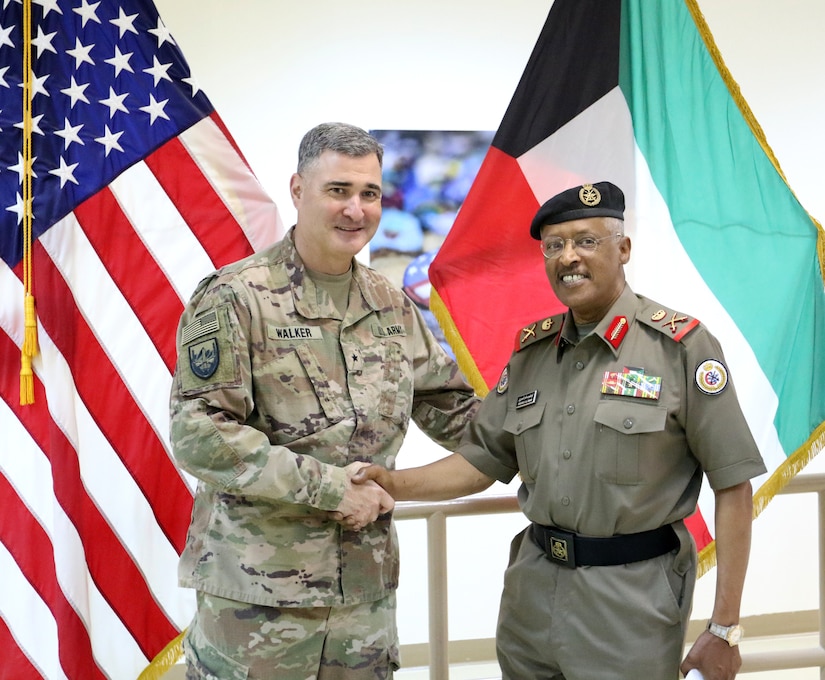 U.S. Army Brig. Gen. Clint E. Walker, commanding general of 184th Sustainment Command, stands with Maj. Gen. Ibrahim Alameeri, head of Medical Health Authority-Kuwait, at Camp Arifjan, Kuwait, May 5, 2019.