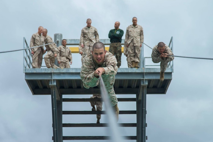 A recruit with Fox Company, 2nd Recruit Training Battalion, descends from the Slide for Life obstacle during Confidence Course II at Marine Corps Recruit Depot San Diego, April 30.