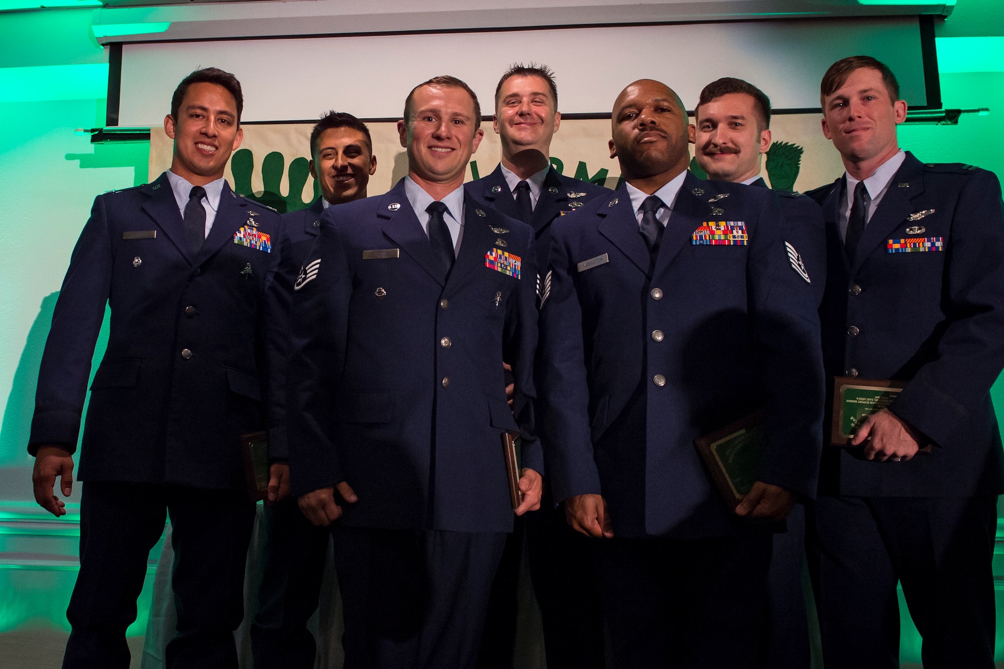 Pararescuemen from the 48th Rescue Squadron (RQS) and aircrew from the 41st RQS, pose for a photo during the banquet celebrating the 50th reunion of the Jolly Green Association (JGA), May 4, 2019, in Fort Walton Beach, Fla. The JGA presented Airmen from the 41st RQS and the 48th RQS with the Rescue Mission of the Year award; the only non Air Force award recognized by the Air Force. (U.S. Air Force Photo by Staff Sgt. Janiqua P. Robinson)