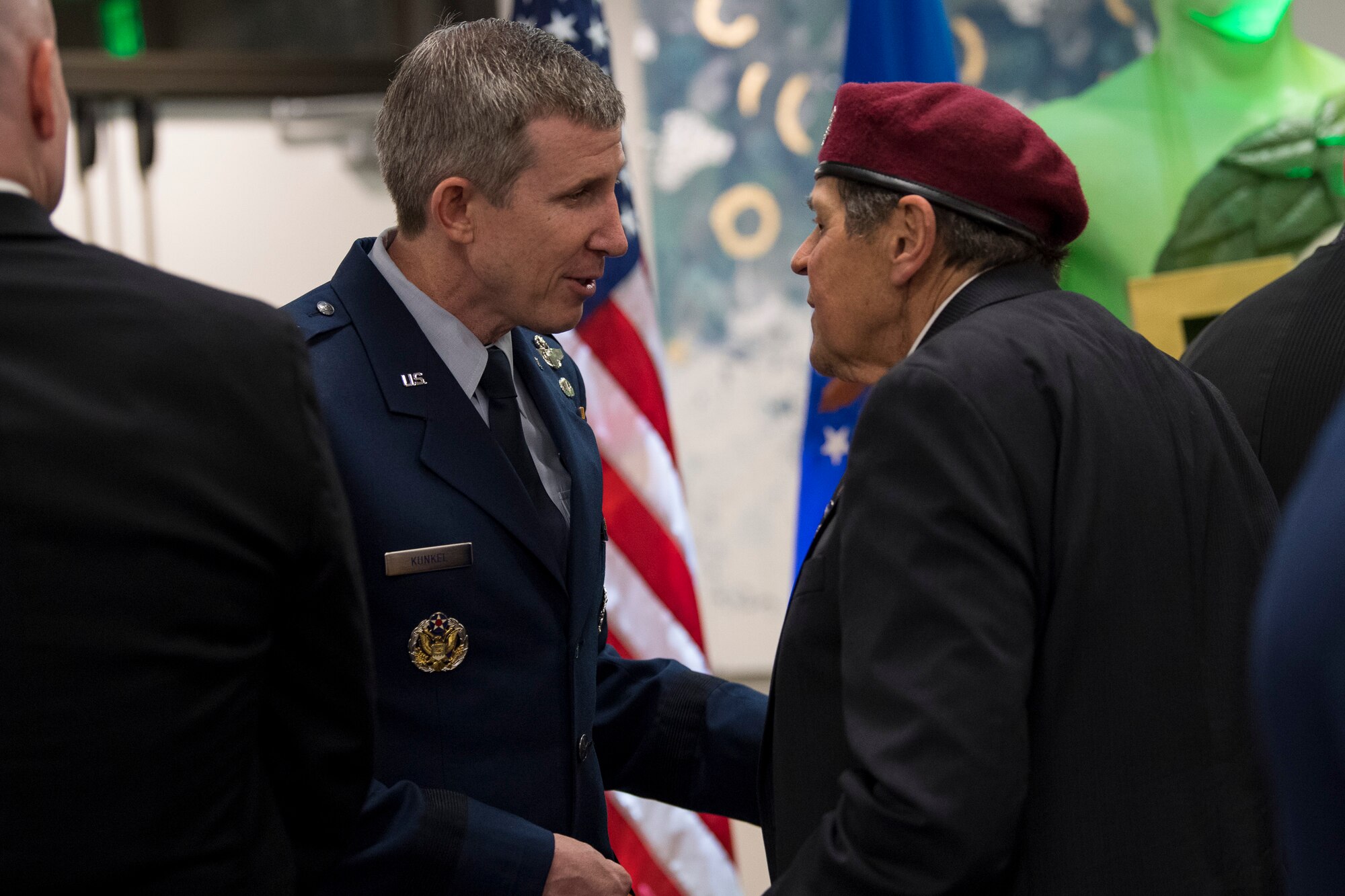 Brig. Gen. Thomas Kunkel, chief Air Force legislative liason to the U.S. House of Representatives, speaks with a member of the Jolly Green Association (JGA) during the banquet celebrating the 50th reunion of the JGA, May 4, 2019, in Fort Walton Beach, Fla. The JGA presented Airmen from the 41st Rescue Squadron (RQS) and the 48th RQS with the Rescue Mission of the Year award; the only non Air Force award recognized by the Air Force. (U.S. Air Force Photo by Staff Sgt. Janiqua P. Robinson)