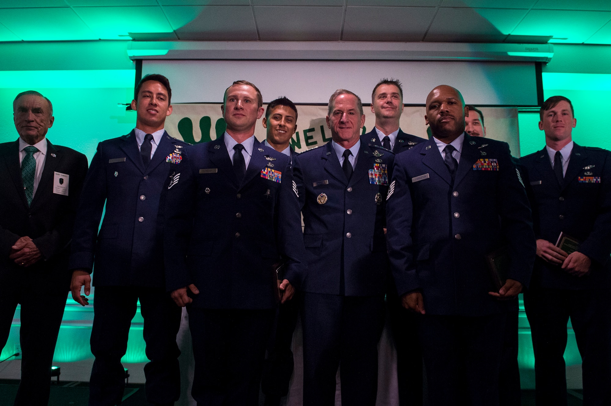 Airmen from the 41st and 48th Rescue Squadron’s (RQS) pose for a photo with Air Force Chief of Staff Gen. David L. Goldfein, during the banquet celebrating the 50th reunion of the Jolly Green Association (JGA), May 4, 2019, in Fort Walton Beach, Fla. The JGA presented Airmen from the 48th and 41st RQS with the Rescue Mission of the Year award; the only non Air Force award recognized by the Air Force. (U.S. Air Force Photo by Staff Sgt. Janiqua P. Robinson)