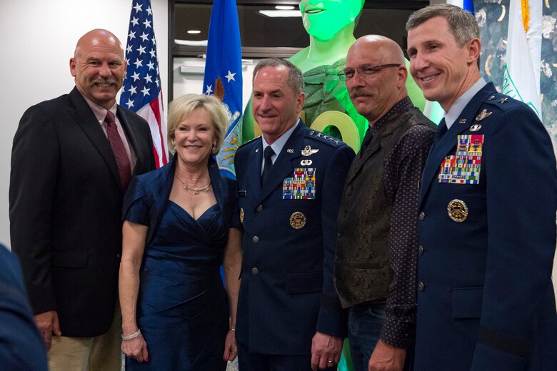 Air Force Chief of Staff Gen. David L. Goldfein, center, and his wife Dawn, pose for a photo with Brig. Gen. Thomas Kunkel, far right, and members of the Jolly Green Association (JGA) during the banquet celebrating the 50th reunion of the JGA, May 4, 2019, in Fort Walton Beach, Fla. The JGA presented Airmen from the 41st Rescue Squadron (RQS) and the 48th RQS with the Rescue Mission of the Year award; the only non Air Force rescue award recognized by the Air Force. (U.S. Air Force Photo by Staff Sgt. Janiqua P. Robinson)