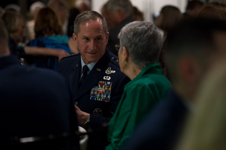 Air Force Chief of Staff Gen. David L. Goldfein speaks with an attendee during the banquet celebrating the 50th reunion of the Jolly Green Association (JGA), May 4, 2019, in Fort Walton Beach, Fla. The JGA presented Airmen from the 41st Rescue Squadron (RQS) and the 48th RQS with the Rescue Mission of the Year award; the only non Air Force rescue award recognized by the Air Force. (U.S. Air Force Photo by Staff Sgt. Janiqua P. Robinson)