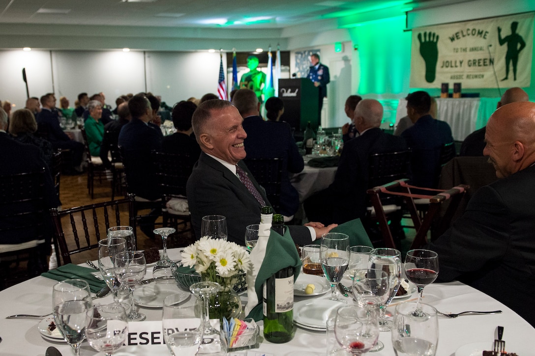 Wayne Fisk, a Jolly Green Association (JGA) member laughs during the banquet celebrating the 50th reunion of the JGA, May 4, 2019, in Fort Walton Beach, Fla. The JGA presented Airmen from the 41st Rescue Squadron (RQS) and the 48th RQS with the Rescue Mission of the Year award; the only non Air Force rescue  award recognized by the Air Force. (U.S. Air Force Photo by Staff Sgt. Janiqua P. Robinson)