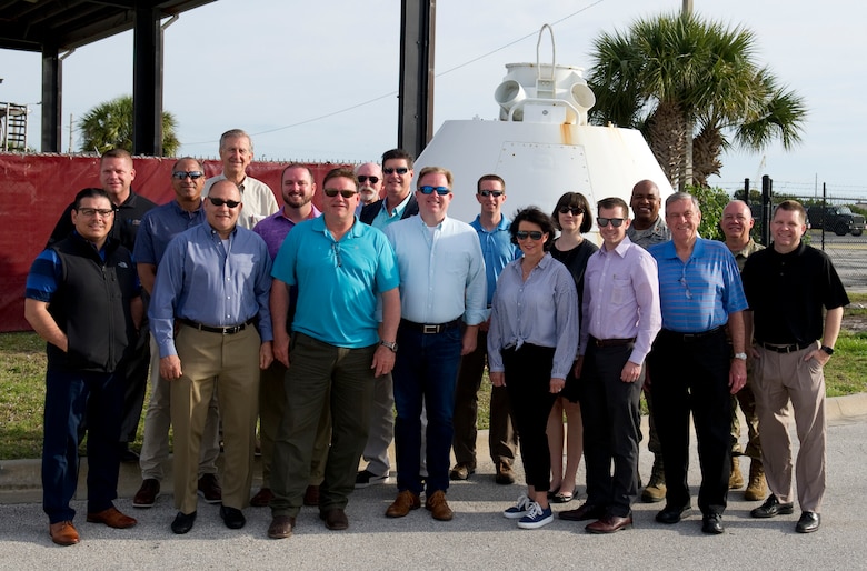 Maj. Gen. Ronald B. “Bruce” Miller, 10th Air Force commander, Naval Air Station Forth Worth, Texas showed up on Florida’s Space Coast with 15 Texas business and community leaders to visit the 920th Rescue Wing at Patrick Air Force Base, Florida and learn about its mission. During the visit the civic leaders took time out for a group photo in front of a space capsule. The capsule was used by U.S. Air Force rescue personnel in the 67th Aerospace Rescue and Recovery Squadron at Royal Air Force Woodbridge to train in recovery operations for both the Apollo and Skylab programs. The capsule has been on loan from the Smithsonian Institute’s National Air and Space museum since 1992 due to the unit’s role in human spaceflight rescue. The PAFB visit was their second stop on Florida’s East Coast after visiting the 482nd Fighter Wing, at Homestead Air Reserve Station, in Miami, earlier that day on April 24, 2019. (U.S. Air Force photo Patrick Air Force Base Multimedia)