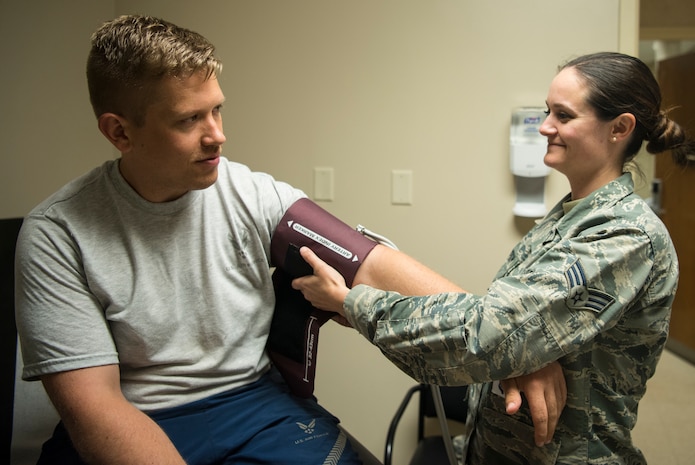 Senior Airman Samantha Thompson, 628th Medical Operations Squadron family health medical technician, places a blood pressure cuff onto a simulated patient May 7, 2019, at Joint Base Charleston’s 628th Medical Group.
