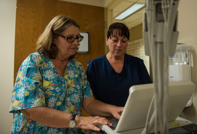 Marie Allen, left, 628th Medical Operations Squadron family health registered nurse works alongside Candy Dybowski, right, 628th Medical Operations Squadron Family Health licensed practical nurse, May 7, 2019, at Joint Base Charleston’s 628th Medical Group.