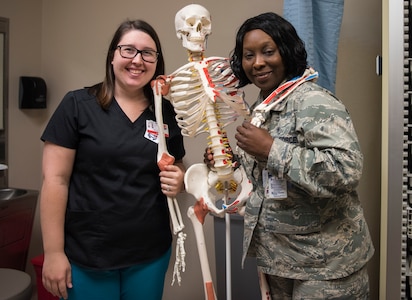 Amber Garren, left, 628th Aerospace Medical Squadron flight medicine nurse, stands with Capt. Tomeka Jones, 628th Aerospace Medical Squadron Flight Medicine nurse, May 7, 2019, at Joint Base Charleston’s 628th Medical Group.