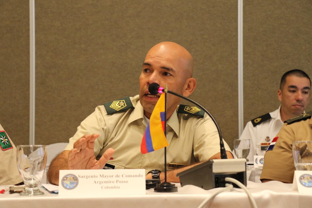 Multinational military members discuss cooperation during a gathering of U.S. and Central American senior enlisted leaders.