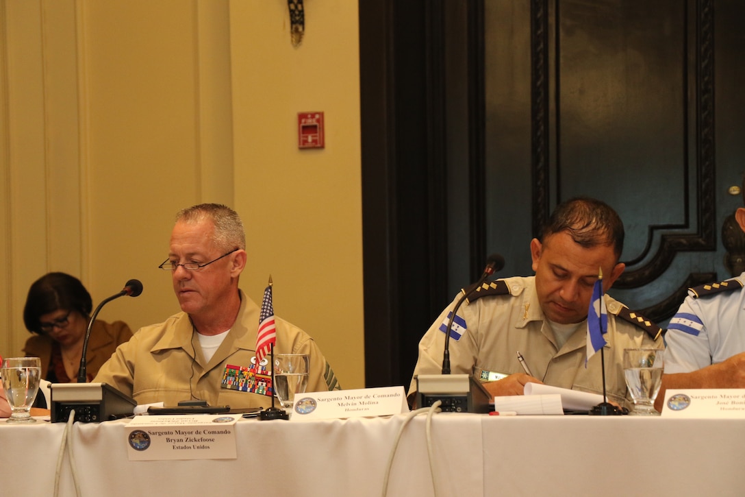 Multinational military members discuss cooperation during a gathering of U.S. and Central American senior enlisted leaders.