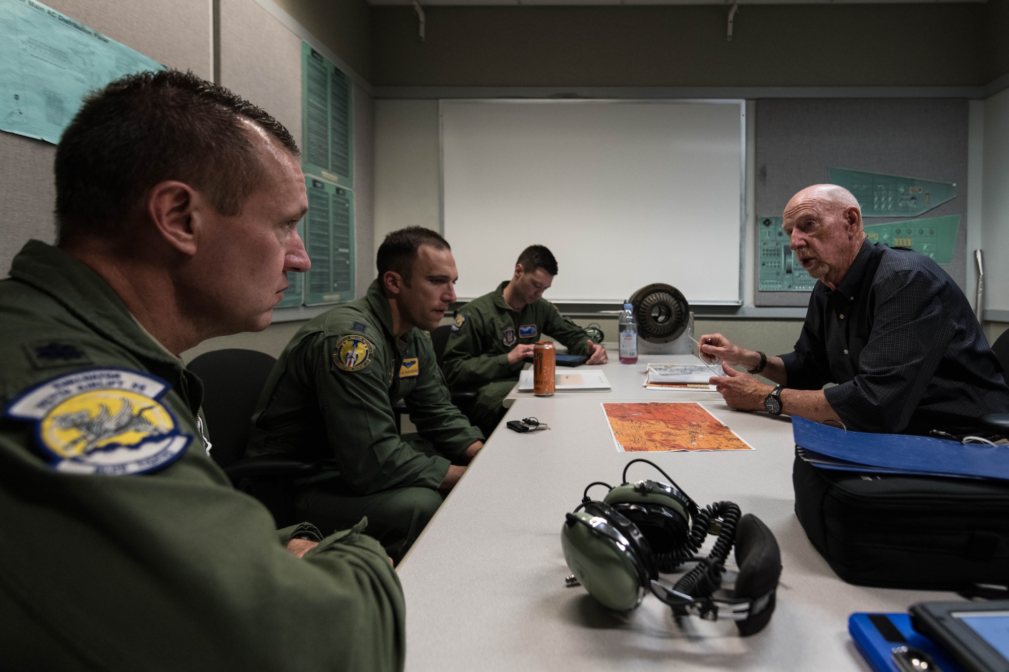 Terry Messer, a C-130 instructor pilot at the Dobbins Eastern Regional Flight Simulator, briefs a 757th Airlift Squadron flight-crew on the simulation they are about to participate in on April 24, 2019, at Dobbins Air Reserve Base, Georgia.