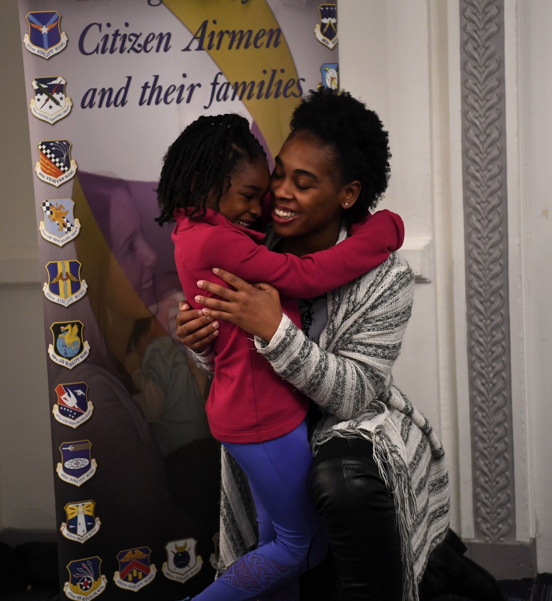 Tech. Sgt. Jocilyn Grable hugs her daughter April 26, 2019, during a Yellow Ribbon Reintegration Program training weekend in Chicago. Grable is the 507th Air Refueling Wing Development and Training Flight program manager at Tinker Air Force Base, Oklahoma. (U.S. Air Force photo by Tech Sgt. Samantha Mathison)