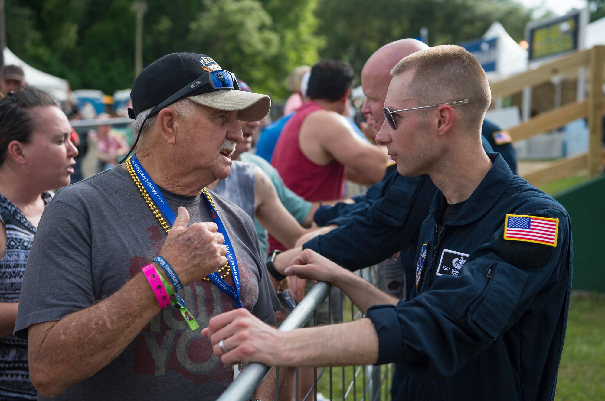 Technical Sgt. Gabriel Staznik, drummer with Max Impact, visits with fans after performing at the Armed Forces Tribute for the 2019 Suwannee River Jam. This event took place at the Spirit of the Suwannee Music Park on Saturday, May 4, 2019. (U.S. Air Force Photo by Chief Master Sgt. Kevin Burns)