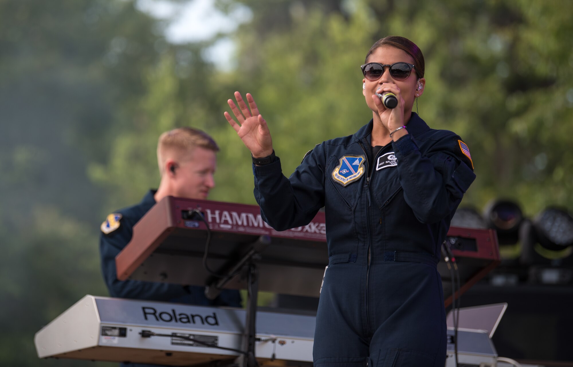 Lead vocalist for Max Impact, Technical Sgt. Nalani Quintello, performs at the Armed Forces Tribute during the 2019 Suwannee River Jam. This event took place at the Spirit of the Suwannee Music Park on Saturday, May 4, 2019. (U.S. Air Force Photo by Chief Master Sgt. Kevin Burns)