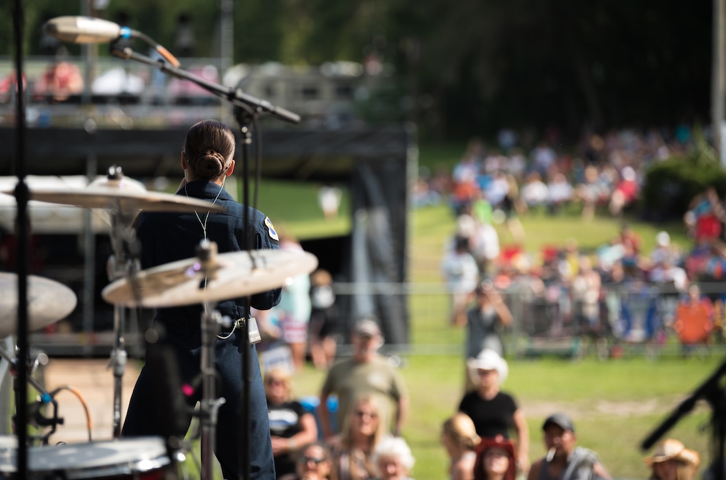 Lead vocalist for Max Impact, Technical Sgt. Nalani Quintello, performs at the Armed Forces Tribute during the 2019 Suwannee River Jam. This event took place at the Spirit of the Suwannee Music Park on Saturday, May 4, 2019. (U.S. Air Force Photo by Chief Master Sgt. Kevin Burns)