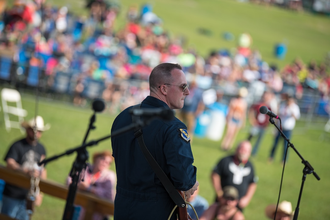 Senior Master Sgt. Matt Ascione, guitarist with Max Impact, performs at the Armed Forces Tribute for the 2019 Suwannee River Jam. This event took place at the Spirit of the Suwannee Music Park on Saturday, May 4, 2019. (U.S. Air Force Photo by Chief Master Sgt. Kevin Burns)