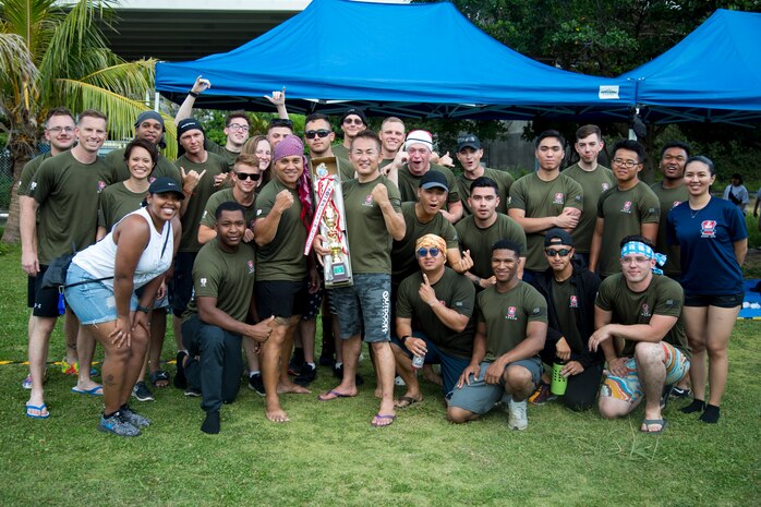 The Single Marine Program dragon boat team poses with their trophy during the 45th Annual Naha Dragon Boat Race May 5, 2019 at Naha Port, Okinawa, Japan. Local and military communities participated in the famous race, also known as the "Haarii." The SMP team won first place in the preliminary heat.