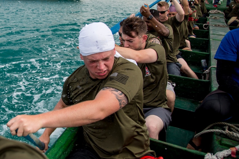 The Single Marine Program dragon boat team rows in sync to gain the most speed during the 45th Annual Naha Dragon Boat Race May 5, 2019, at Naha Port, Okinawa, Japan. Local and military communities participated in the famous race, also known as the "Haarii." The SMP team placed first in their preliminary heat.