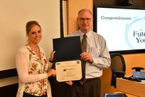 IMAGE: Gill Goddin, Naval Surface Warfare Center Dahlgren Division (NSWCDD) chief engineer, presents a certificate to a NSWCDD Leadership 101 graduate.