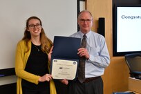 IMAGE: Gill Goddin, Naval Surface Warfare Center Dahlgren Division (NSWCDD) chief engineer, presents a certificate to a NSWCDD Leadership 101 graduate.