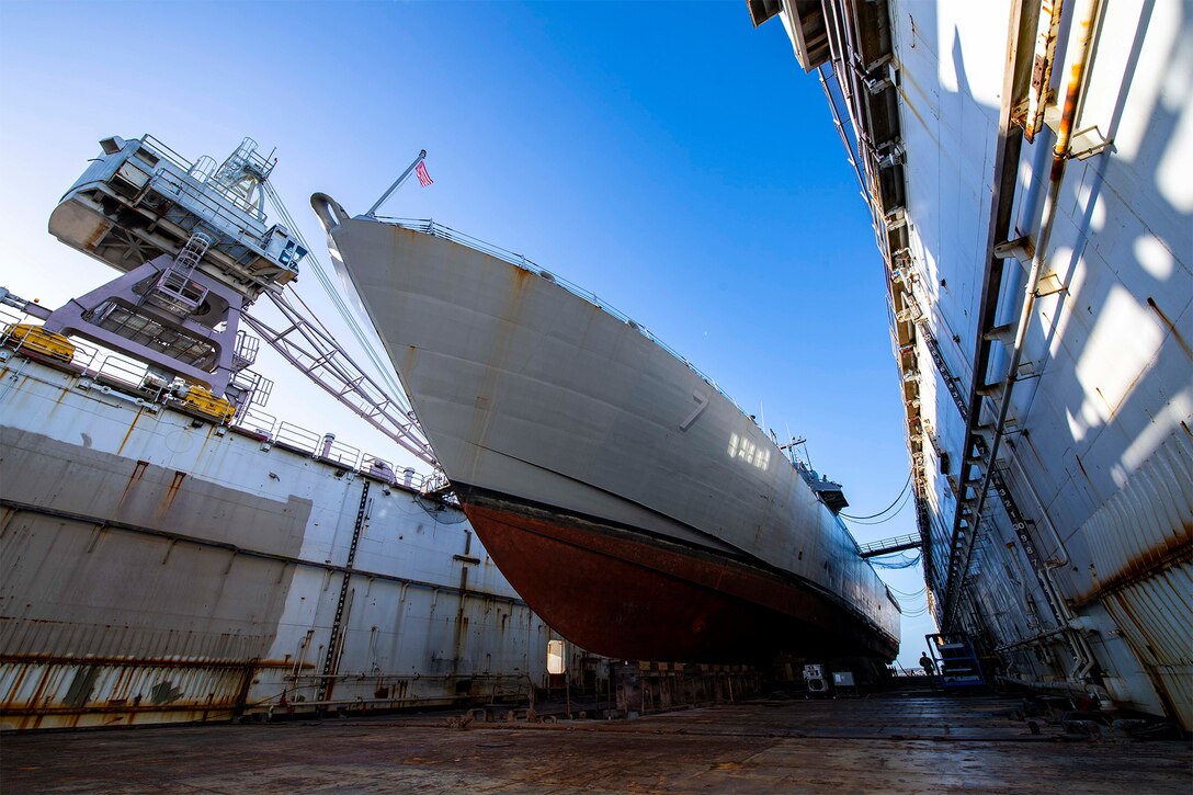 A ship rests in dry dock.