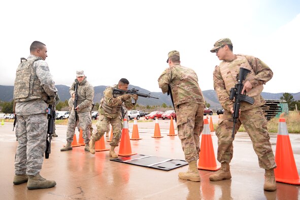 U.S. AIR FORCE ACADEMY, Colo.- Tech. Sgt. Carlos Gonzales, left, 302nd Security Forces Squadron training and logistics noncommissioned officer, teaches how to clear a simulated house for individual movement techniques during 302nd Civil Engineer Squadron’s four-day Unit Training Assembly, May 2, 2019, at the U.S. Air Force Academy, Colorado. About 60 302nd CES reservists completed required and essential training to maintain mission readiness and real-world response techniques. (U.S. Air Force photo by Staff Sgt. Tiffany Lundberg)