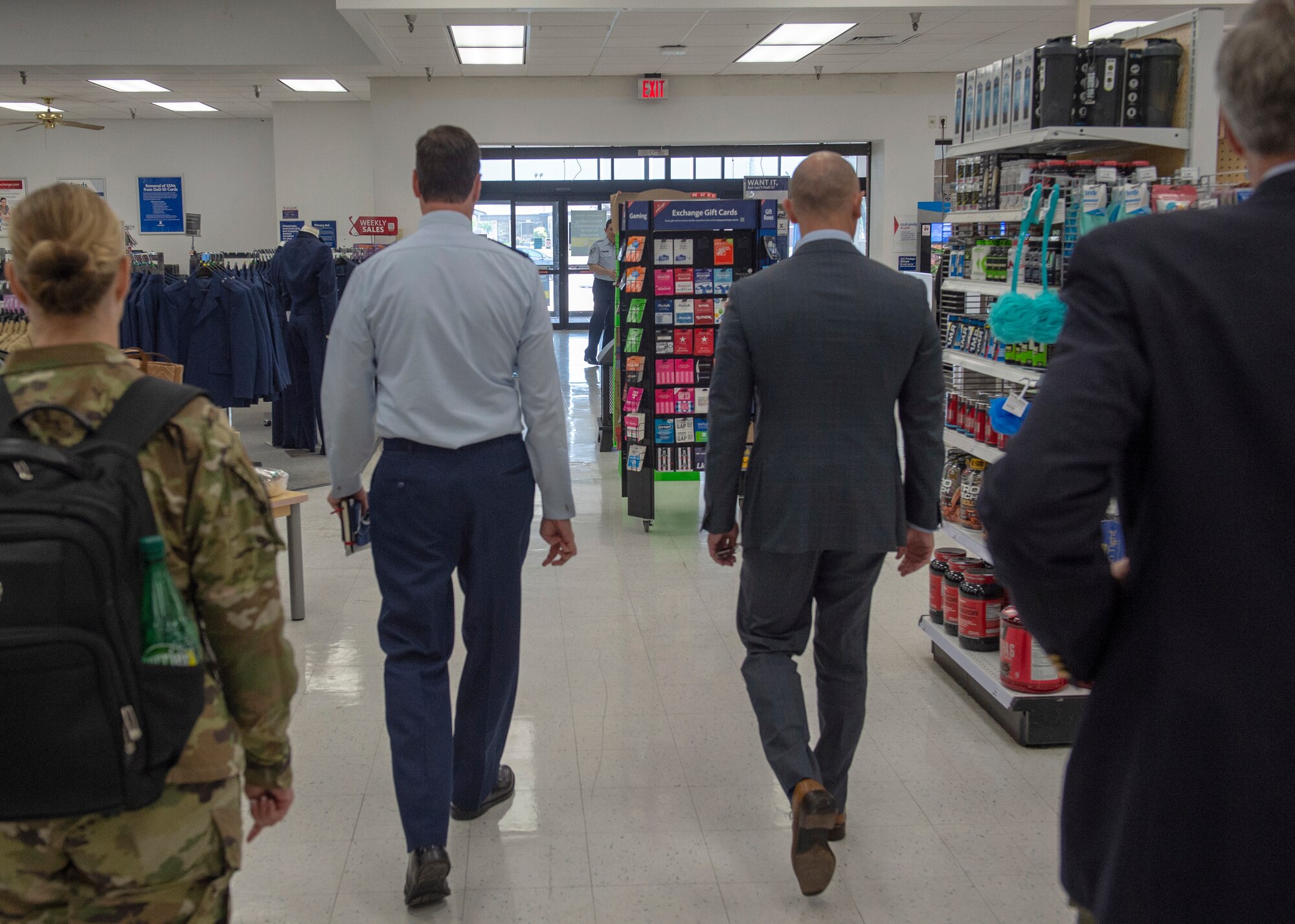 Distinguished Visitors from the Secretary of the Air Force and Navy Manpower/Reserve Affairs walk through the Base Exchange, May 6, 2019, at Altus Air Force Base, Okla. The visitors toured the wing and visited with leaders to discuss areas to improve upon. (U.S. Air Force Photo by Senior Airman Jackson N. Haddon)
