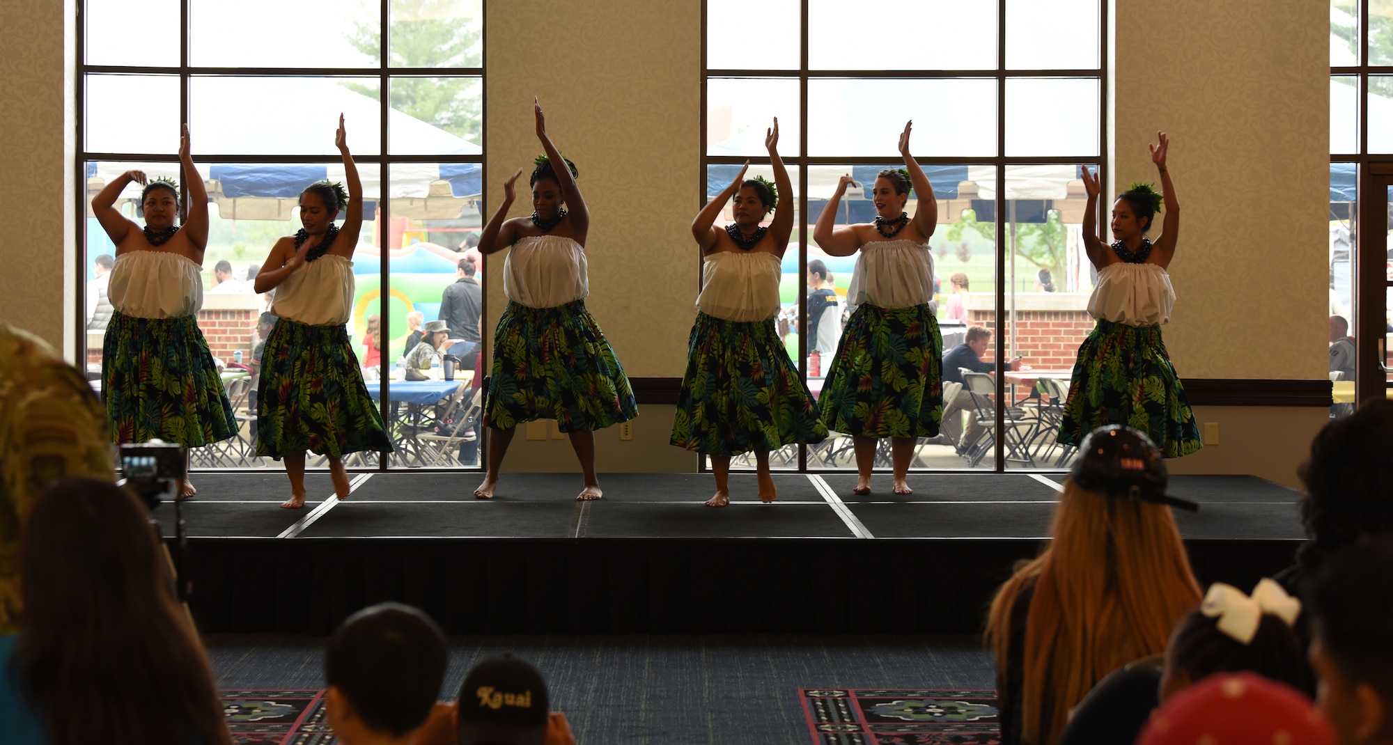 Members of the 808 Ohana of the Midwest dance group treat an audience to a hula performance on May 3, 2019 at Scott Air Force Base, Illinois. The performance was a part of the Scott AFB Wingman Day Diversity Festival. (U.S. Air Force photo by Airman 1st Class Solomon Cook)