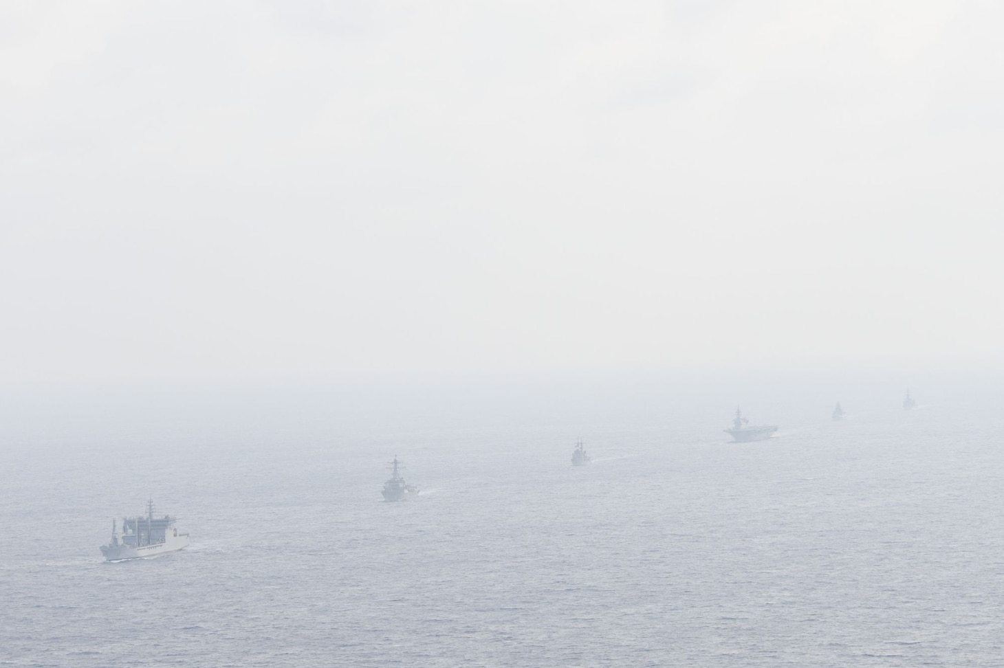 Navy guided-missile destroyer USS William P. Lawrence (DDG 110), transits through international waters with the Indian Navy destroyer INS Kolkata (D 63) and tanker INS Shakti (A 57), Japan Maritime Self-Defense Force helicopter-carrier JS Izumo (DDH 183) and destroyer JS Murasame (DD 101), and Republic of Philippine Navy patrol ship BRP Andres Bonifacio (PS 17) through the South China Sea.