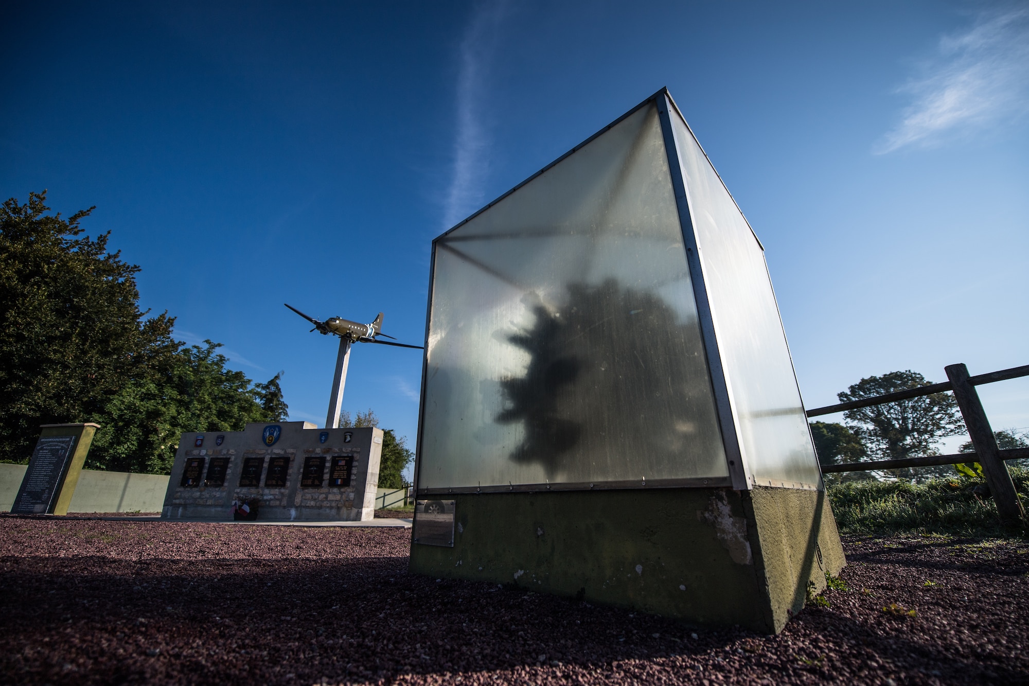 An engine from an aircraft flown over Normandy in WWII sits in a weathered display case in Picauville, France, May 30, 2019. The aircraft, which contained U.S. paratroopers, was downed near Picauville on D-Day and now honors all who were downed that day. (U.S. Air Force photo by Staff Sgt. Devin Boyer)