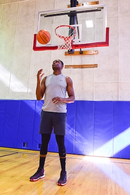 Towering above most, Akinyemi Solanke, a structural apprentice with the 434th Civil Engineer Squadron, is right at home under the basket May 5, 2019 at Grissom Air Reserve Base, Indiana. The 6'11" native of Nigeria hopes to earn a roster spot with the All-Air Force men's basketball team. (U.S. Air Force photo/Staff Sgt. Chris Massey)