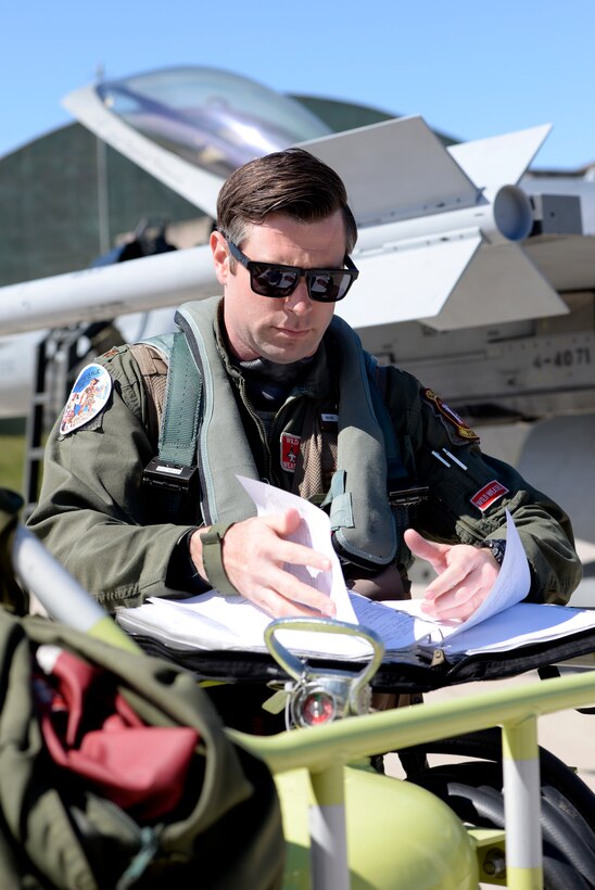 U.S. Air Force Maj. Kevin Bunten, 480th Fighter Squadron Assistant Director of Operations, reads through pre-flight information before flying a low-level training sortie at RAF Lossiemouth, Scotland, May 7, 2019, during exercise Formidable Shield. The 480th FS deployed from Spangdahlem Air Base, Germany, in support of the exercise. Nine nations are participating in Formidable Shield by sending ships and aircraft, including Canada, Denmark, France, Italy, the Netherlands, Norway, Spain, the United Kingdom and the United States. Both Belgium and Germany are supporting the exercise as well. (U.S. Air Force photo by Master Sgt. Austin M. May)