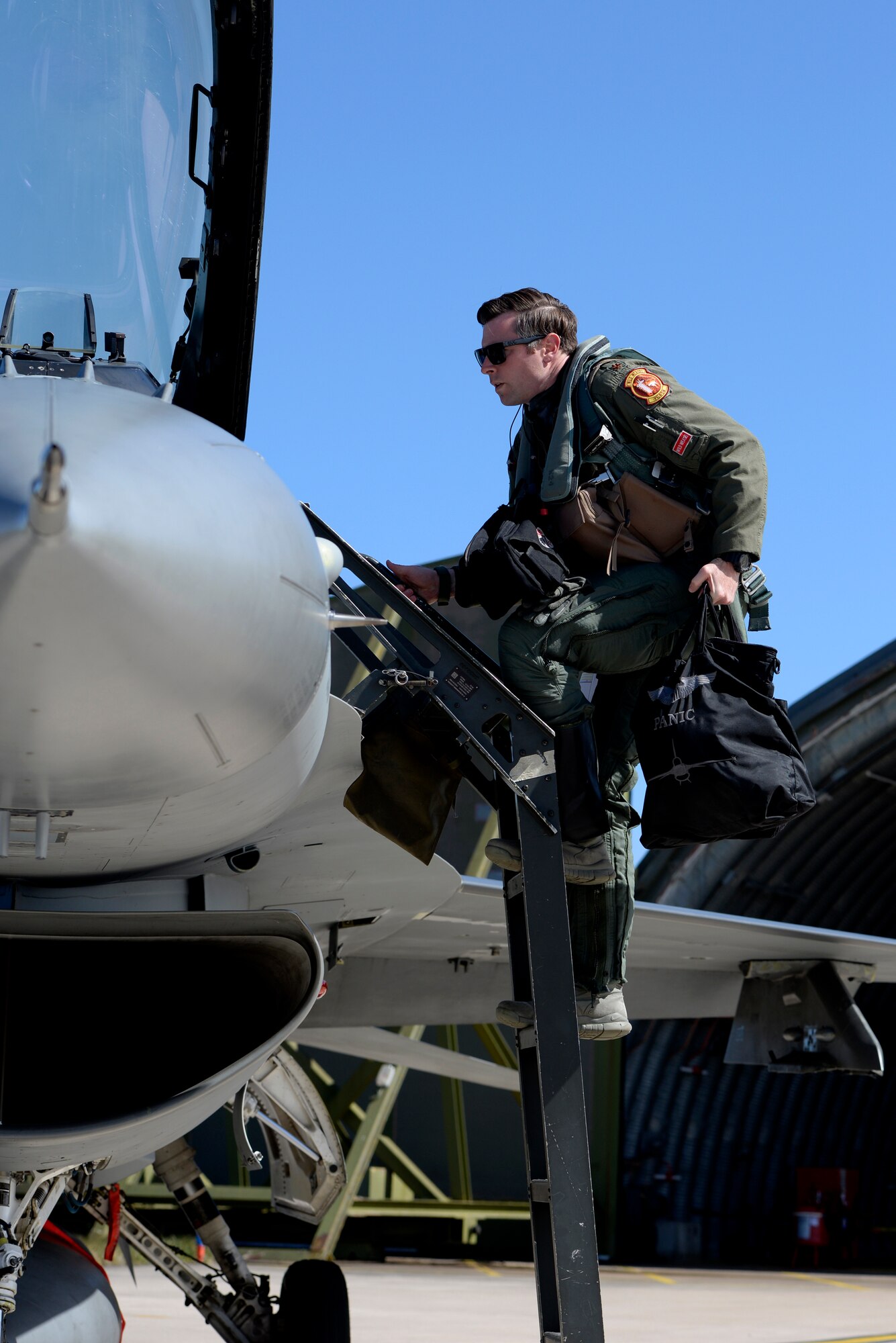 U.S. Air Force Maj. Kevin Bunten, 480th Fighter Squadron Assistant Director of Operations, scales the ladder of his F-16 Fighting Falcon before flying a low-level training sortie at RAF Lossiemouth, Scotland, May 7, 2019, during exercise Formidable Shield. Formidable Shield is a U.S.-led exercise, conducted by Naval Striking and Support Forces NATO. The purpose of the training is to improve allied interoperability in a live-fire integrated air and missile defense exercise. (U.S. Air Force photo by Master Sgt. Austin M. May)