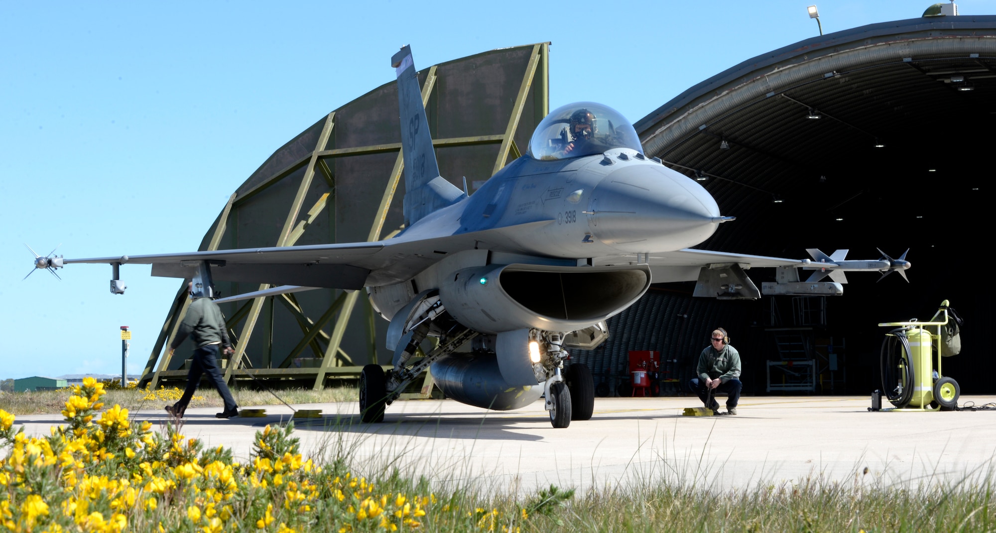 U.S. Air Force Airmen from the 52nd Aircraft Maintenance Squadron, Spangdahlem Air Base, Germany, perform the final pre-flight procedures before launching an F-16 Fighting Falcon, flown by U.S. Air Force Major Kevin Bunten, 480th Fighter Squadron Assistant Director of Operations, on a low-level training sortie at RAF Lossiemouth, Scotland, May 7, 2019, during exercise Formidable Shield. Formidable Shield is a U.S.-led exercise, conducted by Naval Striking and Support Forces NATO. The purpose of the training is to improve allied interoperability in a live-fire integrated air and missile defense exercise. (U.S. Air Force photo by Master Sgt. Austin M. May)