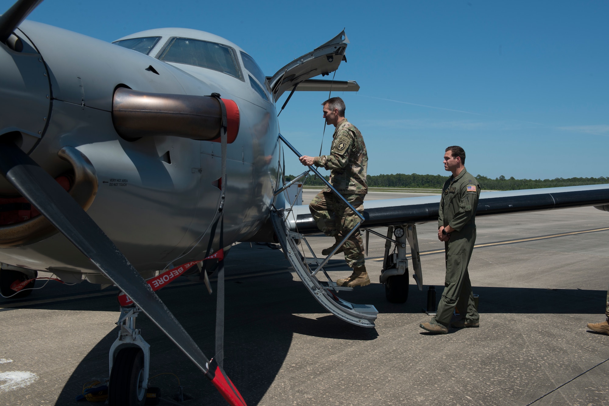 One person climbing into an aircraft.