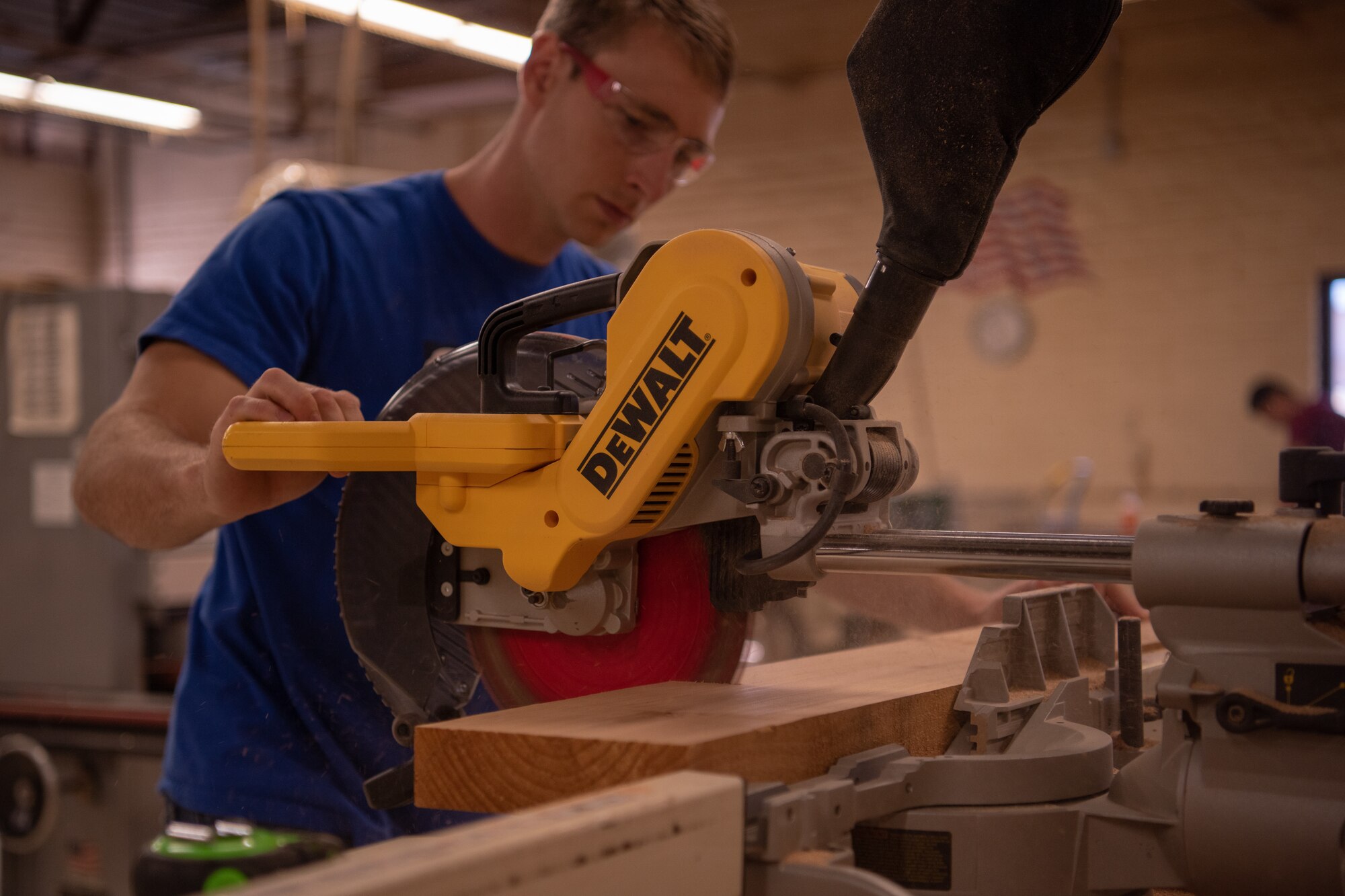 U.S. Air Force Staff Sgt. Thomas Johnson, 56th Component Maintenance Squadron weapons load crew chief, uses a miter saw in the 56th Force Support Squadron Wood Craft Shop to cut measurements May 4, 2019, at Luke Air Force Base, Ariz.