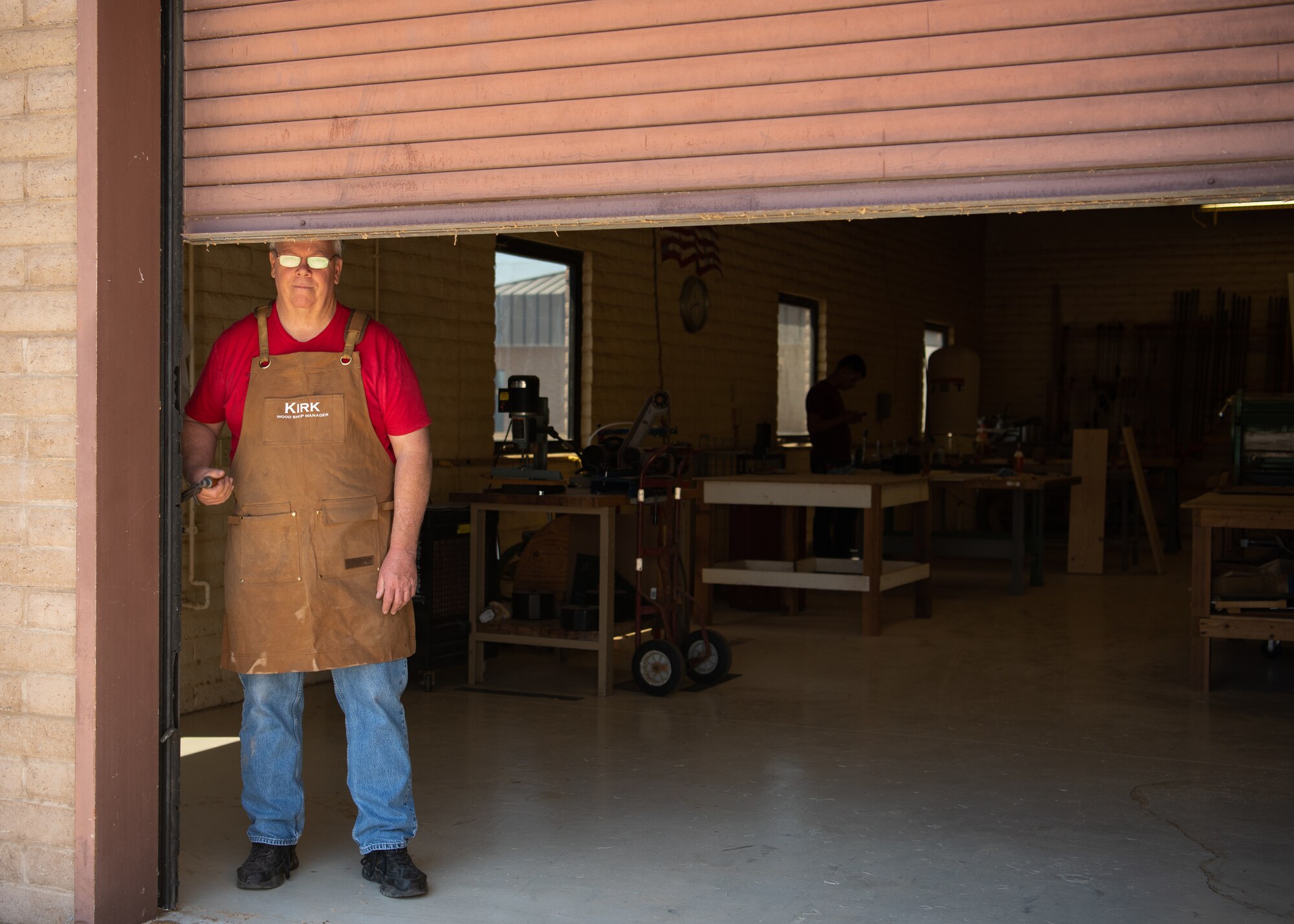Kirk McCarty, 56th Force Support Squadron Wood Craft Shop manager, closes down after a long day, shutting the bay door May 4, 2019, at Luke Air Force Base, Ariz.