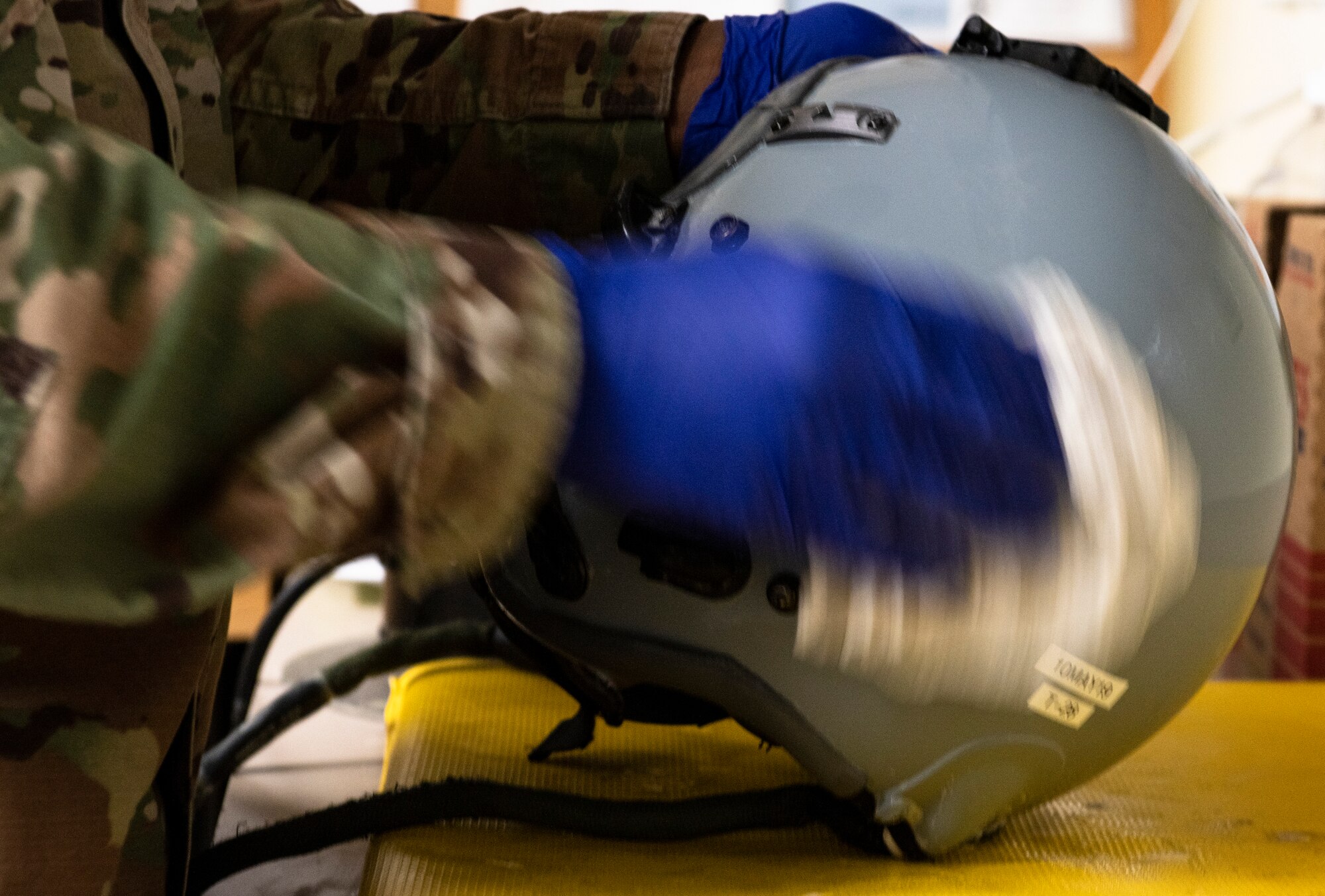 U.S. Air Force Senior Airman Devin Schumpert, 20th Operations Support Squadron aircrew flight equipment technician, polishes a pilot helmet at Shaw Air Force Base, S.C., May 8, 2019.