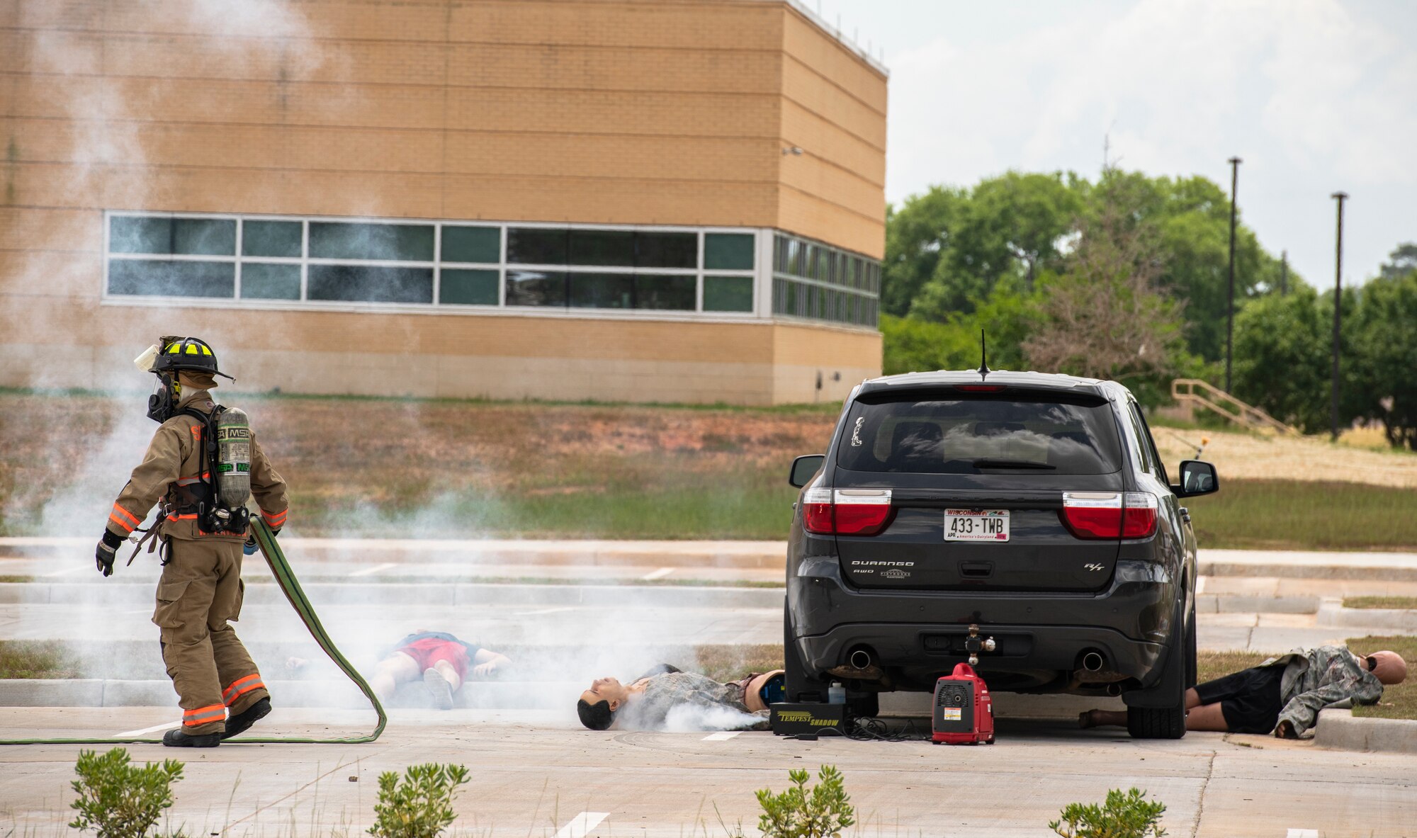 Senior Airman William Watson, 20th Civil Engineer Squadron firefighter, extinguishes a simulated car bomb during a chemical, biological, radiological and nuclear attack exercise at Shaw Air Force Base, S.C., May 2, 2019.