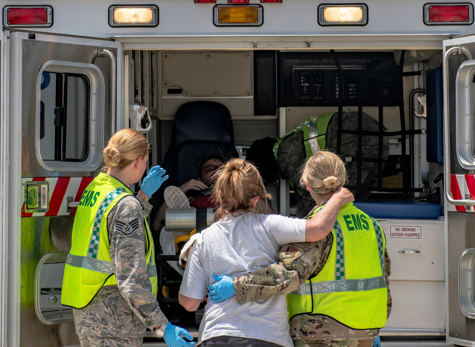 U.S. Airmen assigned to the 20th Medical Group escort a simulated victim to an ambulance during a chemical, biological, radiological and nuclear attack exercise at Shaw Air Force Base, S.C., May 2, 2019.