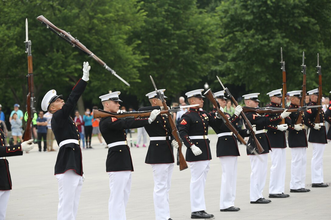 Marines with the U.S. Marine Corps Silent Drill Platoon, Marine Barracks Washington D.C., perform for an Honor Flight at the Lincoln Memorial, Washington, D.C., May 8, 2019. An Honor Flight is conducted by non-profit organizations dedicated to transporting as many United States military veterans as possible to see the memorials in D.C. of the respective war they fought in at no cost to the veterans. (U.S. Marine Corps photo by Pfc. Allen Sanders)