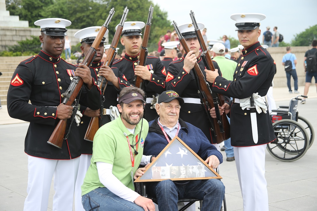 Marines with the U.S. Marine Corps Silent Drill Platoon meet and greet with U.S. veterans attending an Honor Flight at the conclusion of a performance at the Lincoln Memorial, Washington, D.C., May 8, 2019. An Honor Flight is conducted by non-profit organizations dedicated to transporting as many United States military veterans as possible to see the memorials in D.C. of the respective war they fought in at no cost to the veterans. (U.S. Marine Corps photo by Pfc. Allen Sanders)