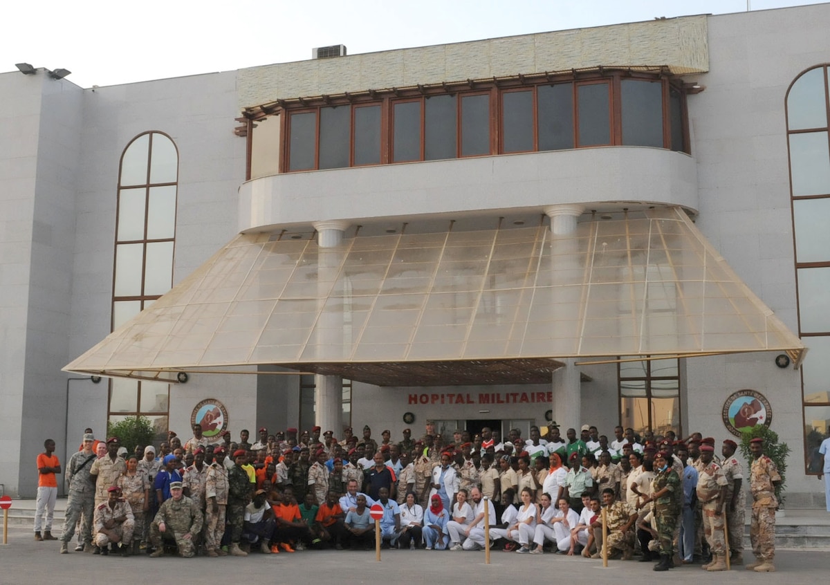 A contingent of Soldiers and Airmen from the Kentucky National Guard pose with staff of the Ah-Bashir Military Hospital after a two-day mass casualty exercise held in Djubouti City, Djibouti, April 2, 2019, as part of the State Partnership Program. (U.S. Army National Guard photo by Staff Sgt. Benjamin Crane)