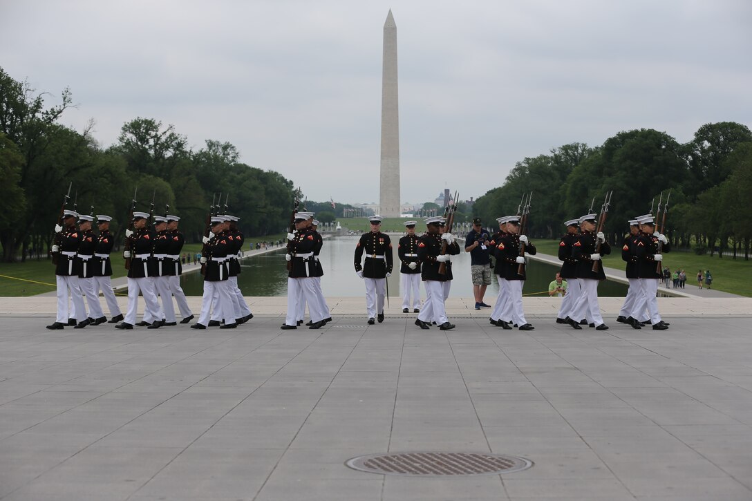 Marines with the U.S. Marine Corps Silent Drill Platoon, Marine Barracks Washington D.C., perform for an Honor Flight at the Lincoln Memorial, Washington, D.C., May 8, 2019. An Honor Flight is conducted by non-profit organizations dedicated to transporting as many United States military veterans as possible to see the memorials in D.C. of the respective war they fought in at no cost to the veterans. (U.S. Marine Corps photo by Pfc. Allen Sanders)